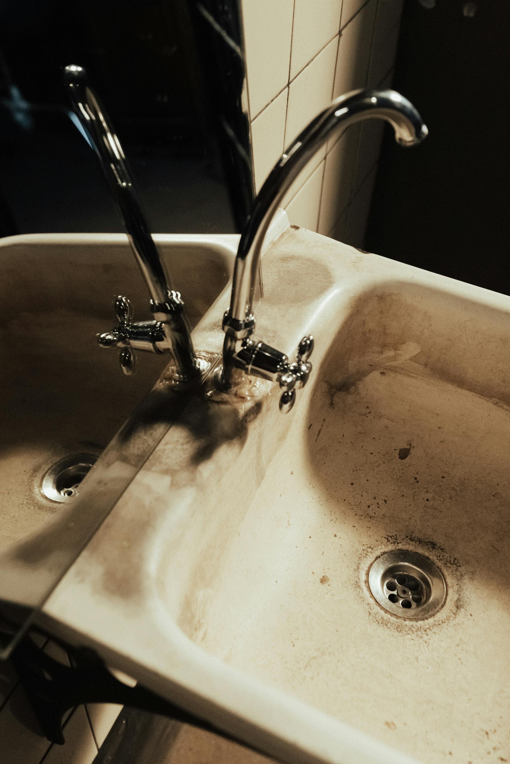 Bathroom sink area in a home near Government Center; under-sink leaks are a frequent, often-hidden source of mold behind cabinetry